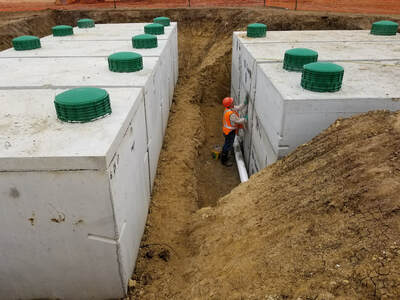 Commercial Concrete wastewater tanks, withRIsers, designed for any large scale or commercial wastewater treatment system.  Sewer systems for resorts and RV parks. 